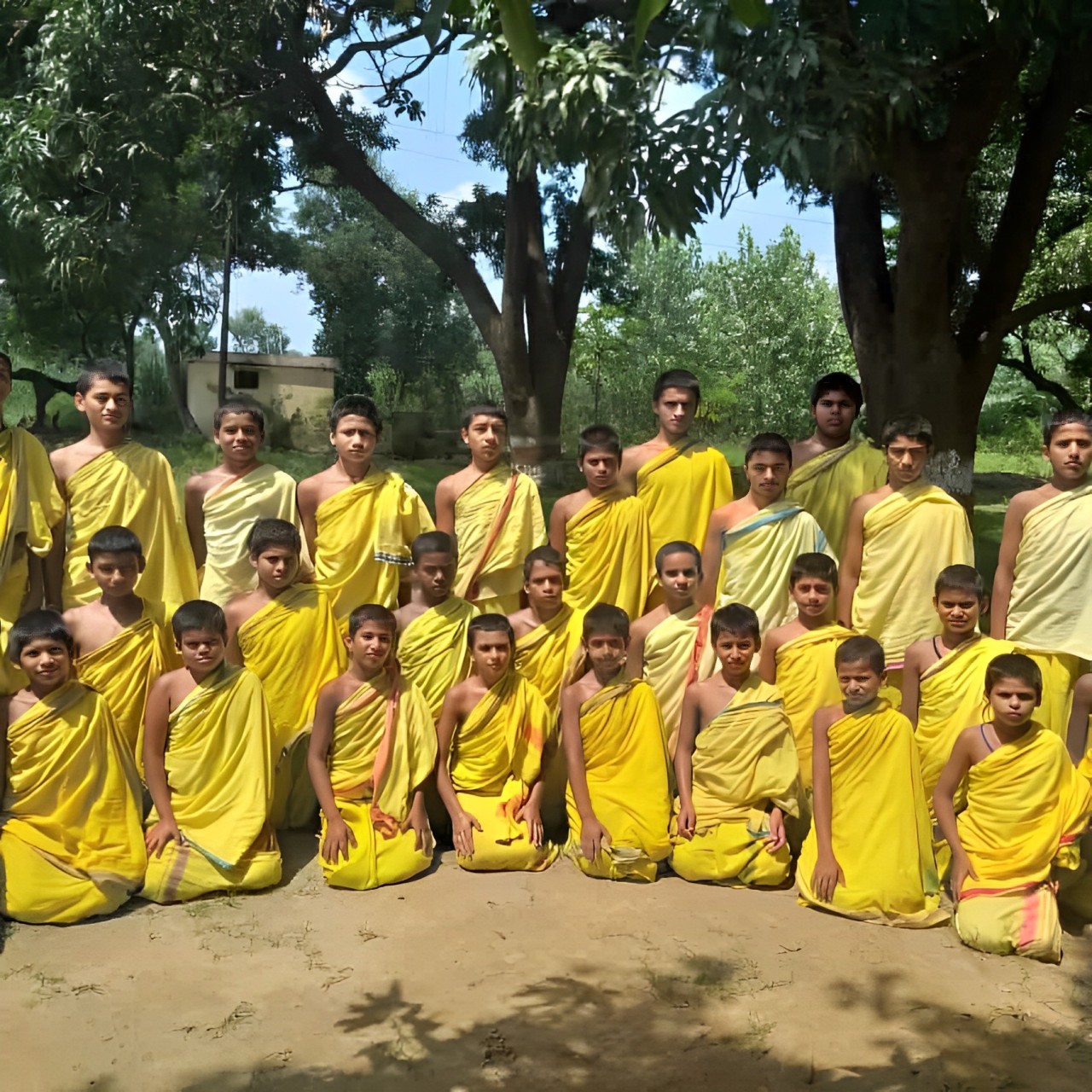 Traditional Gurukul scholars gathered in ceremonial attire