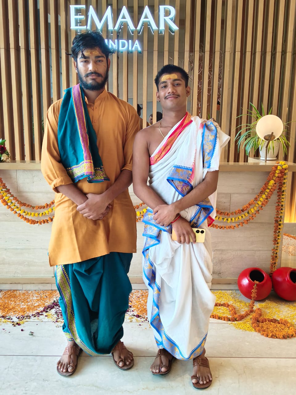Professionally attired Vedic pandits at a puja venue